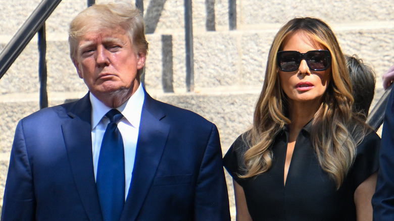 Donald and Melania Trump standing next to each other