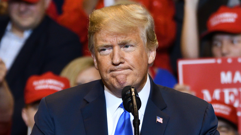 Donald Trump at podium giving a speech in 2018