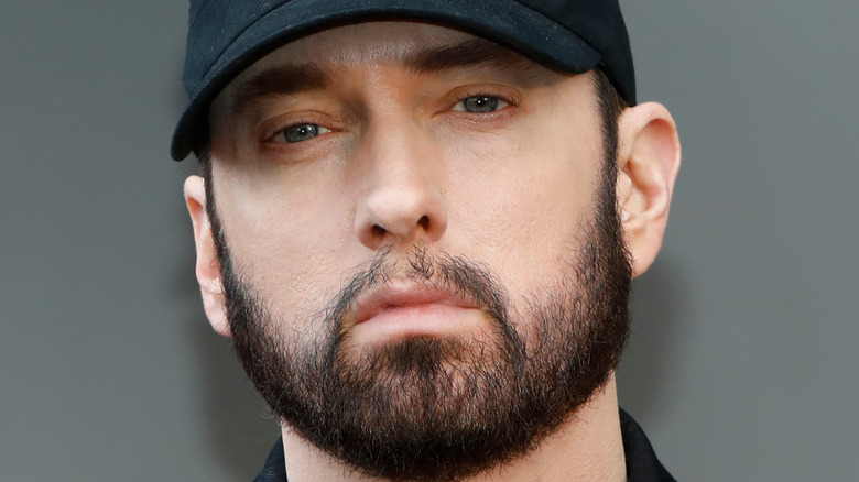 Eminem wears a black cap