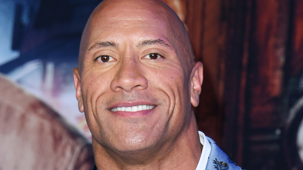 Dwayne Johnson smiling at an event