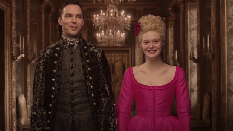 Nicholas Hoult, Elle Fanning laughing in The Great costumes