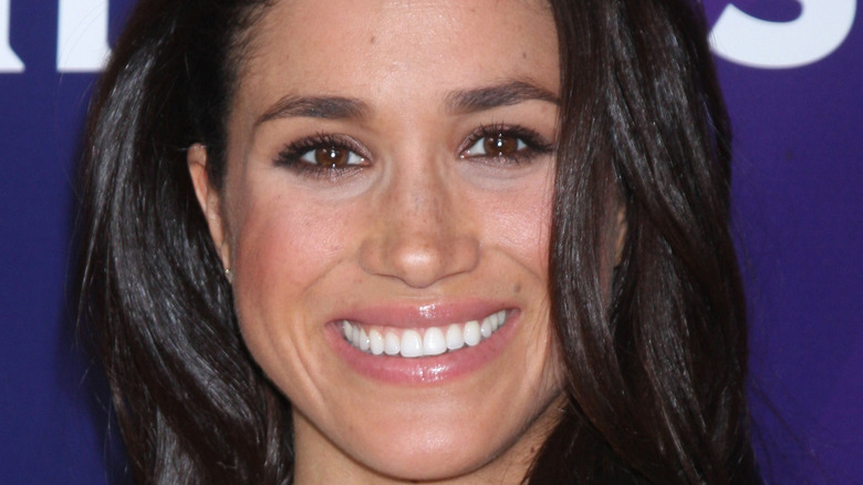 Meghan Markle smiling at an event