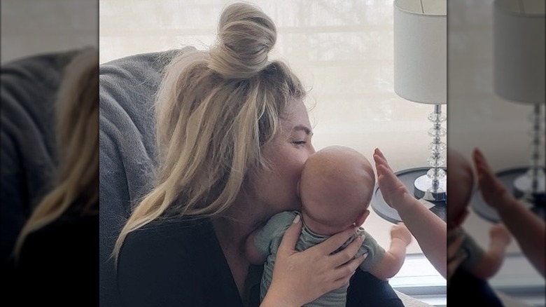 Erika Kirk holding her baby