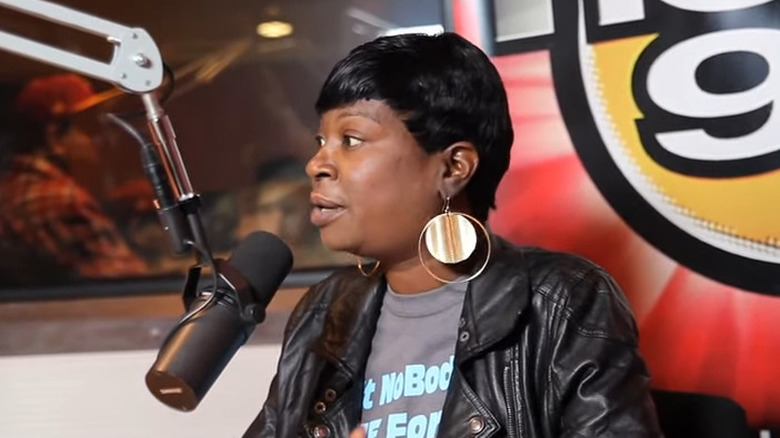 Sweet Brown wears golden earrings 