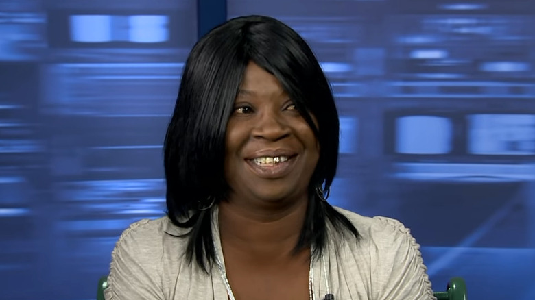 Sweet Brown in a black wig