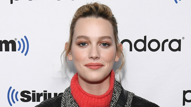 Victoria Pedretti posing at step and repeat