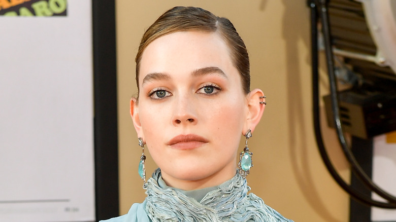 Victoria Pedretti posing in teal dress