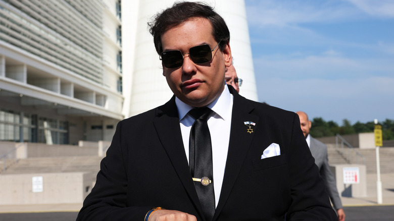 George Santos pictured outside a court hearing.