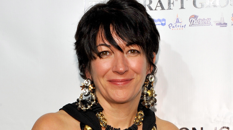 Ghislaine Maxwell smiling long earrings