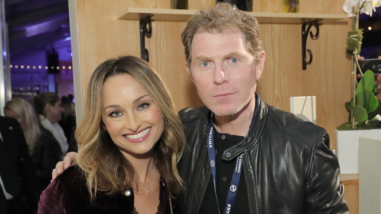 Giada De Laurentiis and Bobby Flay smiling