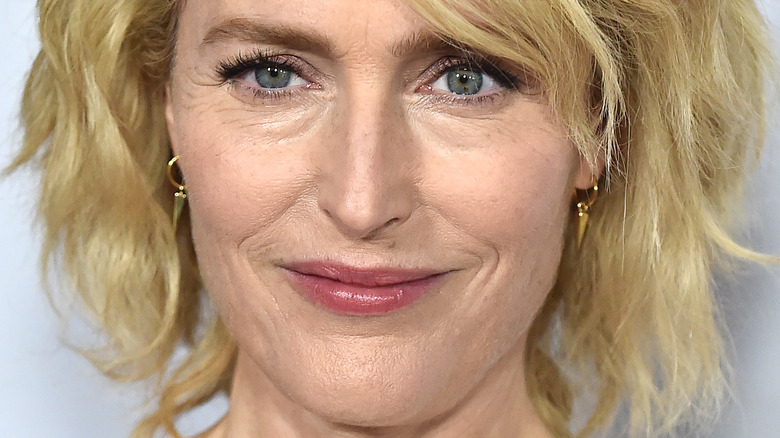 Gillian Anderson smiles in short blond hair