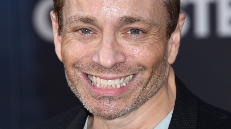 Chris Kattan smiling at the camera
