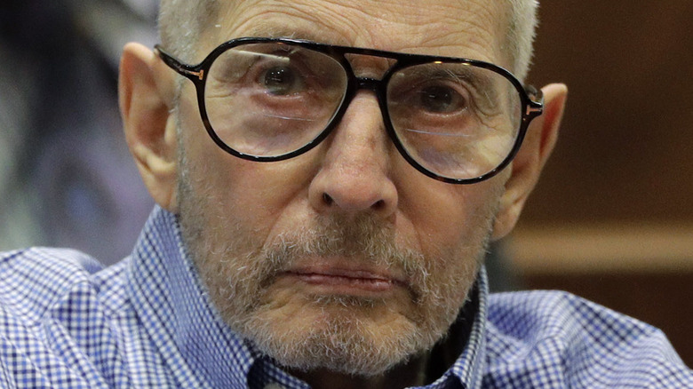 Robert Durst wearing black-framed glasses in court