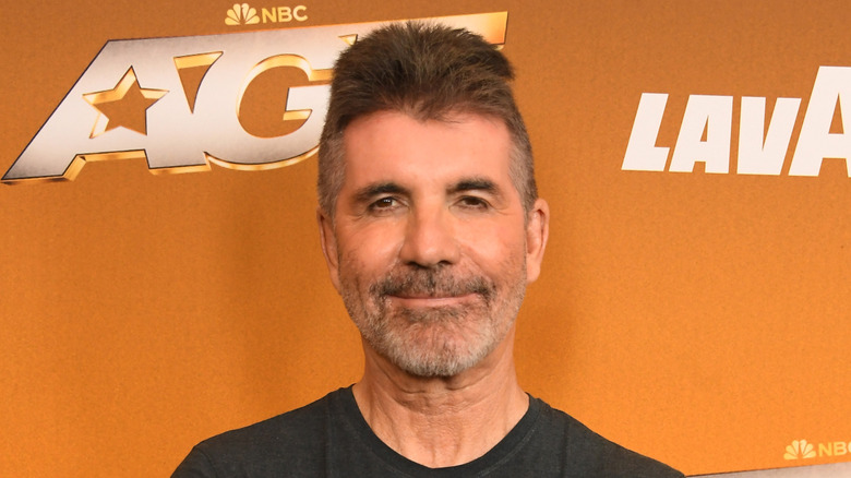 Simon Cowell poses in 2025