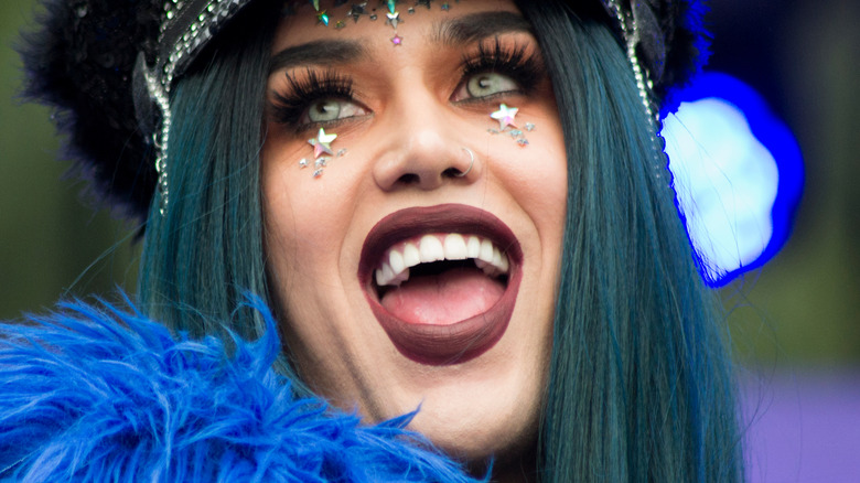 Adore Delano smiles