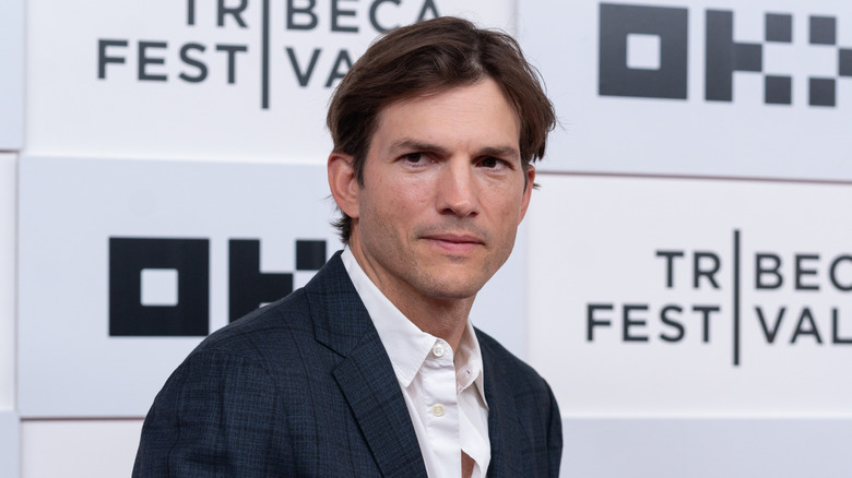 Ashton Kutcher poses in 2022