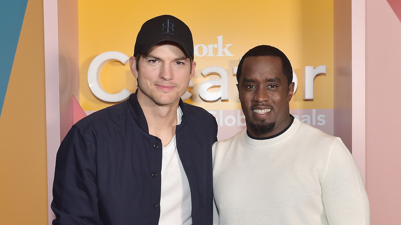 Ashton Kutcher and Diddy pose in 2019
