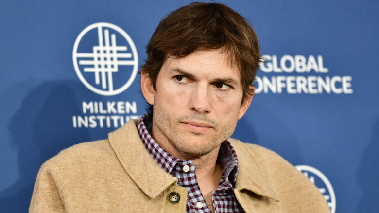 Ashton Kutcher looks sideways in 2023
