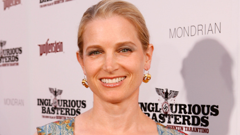 Bridget Fonda smiling in full glam