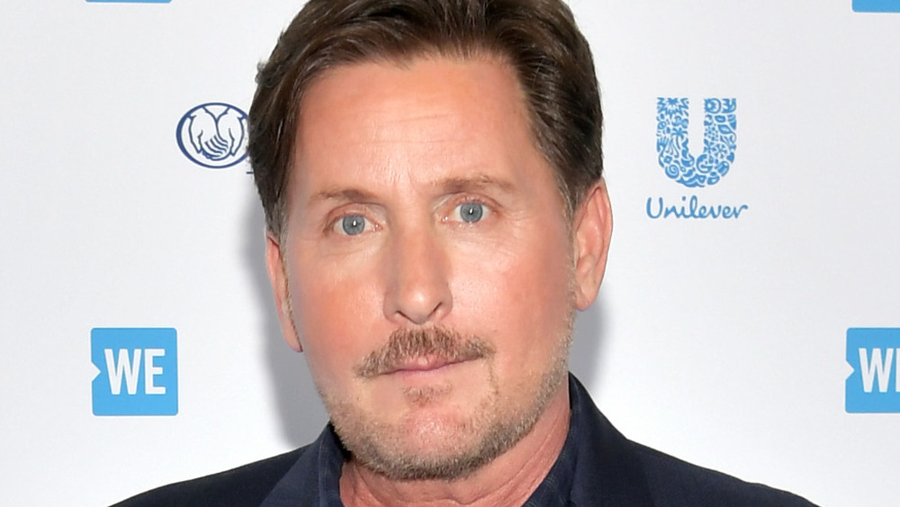 Emilio Estevez posing on red carpet