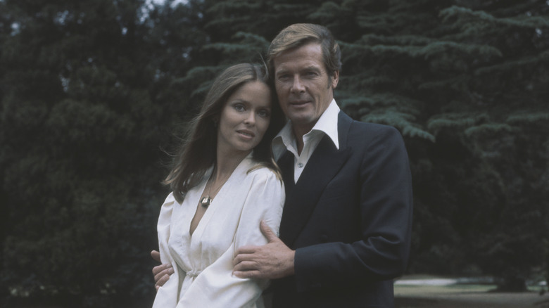 Barbara Bach and Roger Moore posing