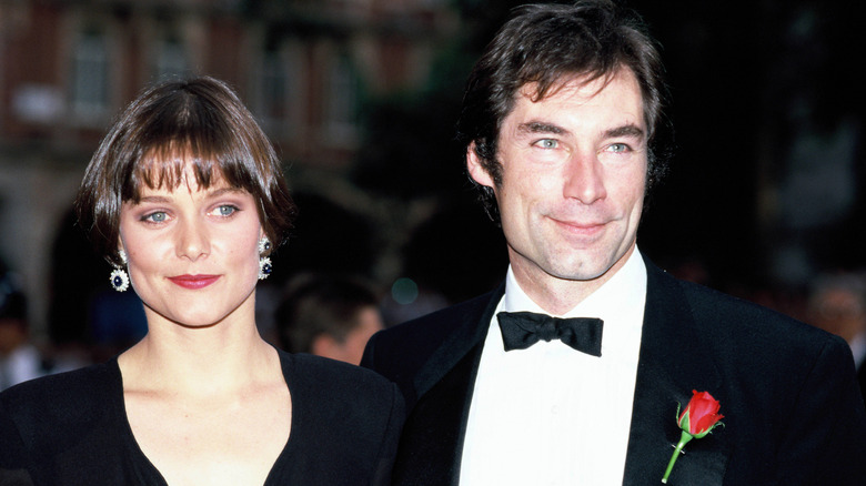 Carey Lowell and Timothy Dalton, both smiling