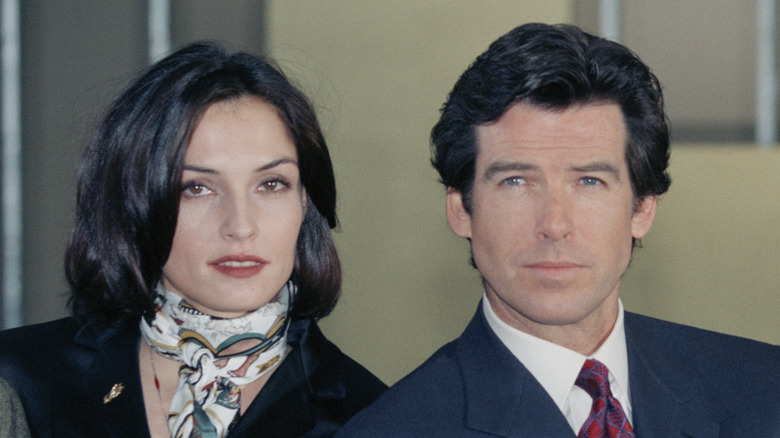 Pierce Brosnan and Famke Janssen posing