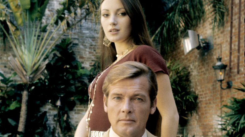 Jane Seymour and Roger Moore posing
