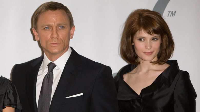 Gemma Arterton posing with Daniel Craig