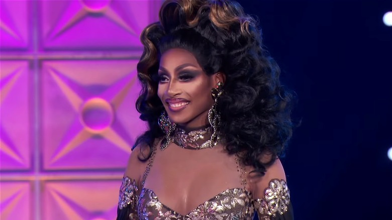 Jaida Essence Hall big brown hair silver dress