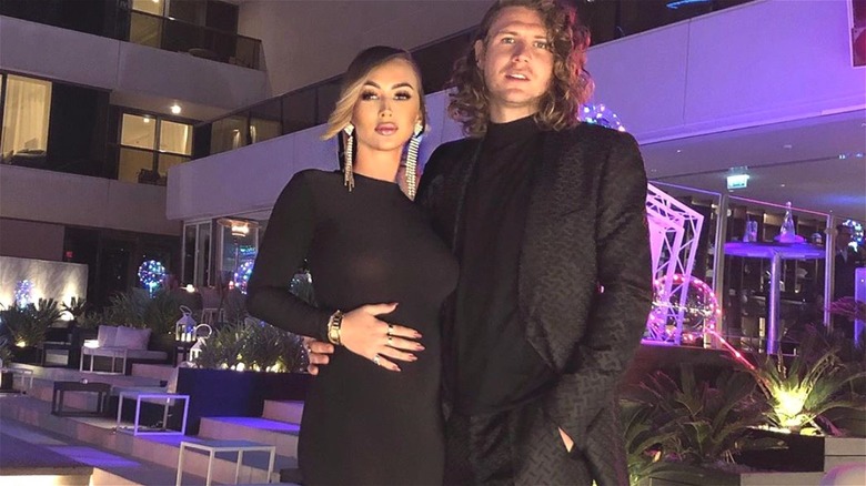 Pregnant Kelly Hidge posing with Jack Stirrup