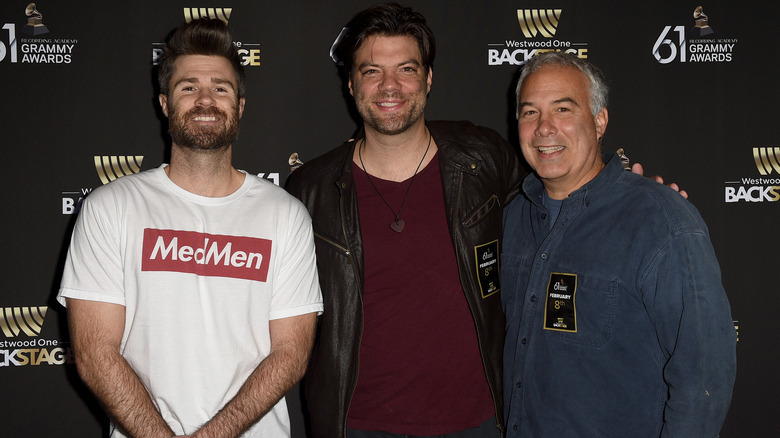 Jordan Eubanks, Brian Drolet, and Christopher Livingstone at an event