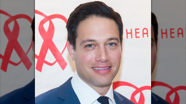 Eric Villency posing at an event.