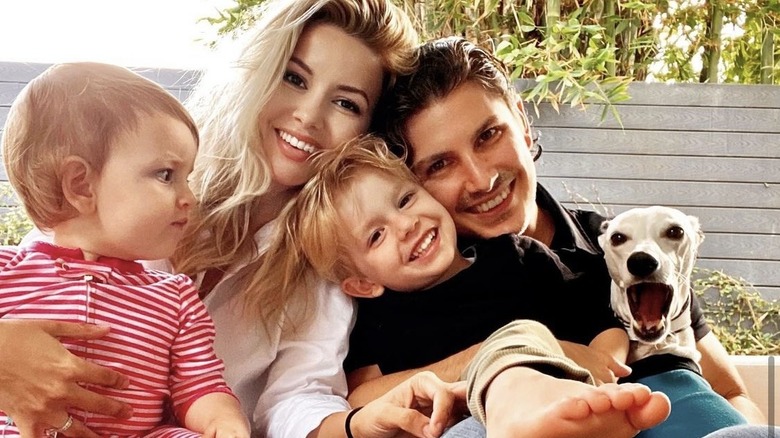 Masiela Lusha, with her children and husband, smiling