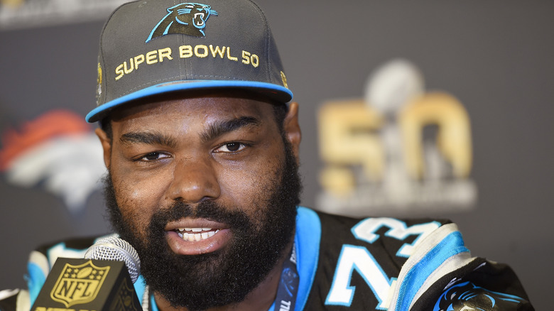 Michael Oher wearing a hat