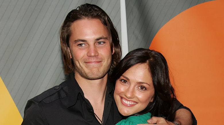 Taylor Kitsch posing with Minka Kelly