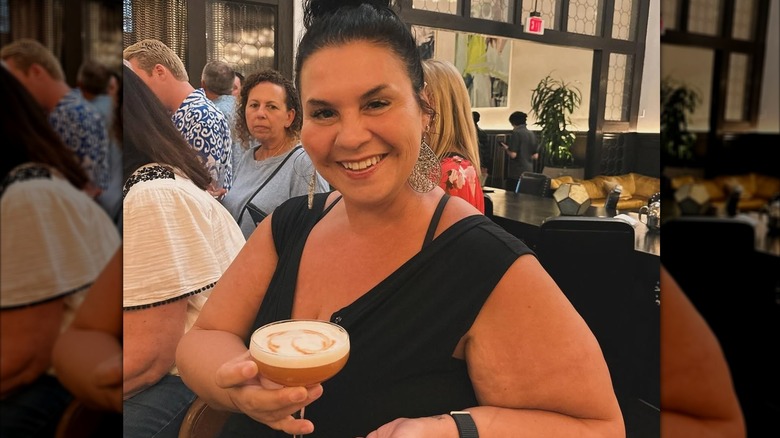Deanna Colon holding a cocktail