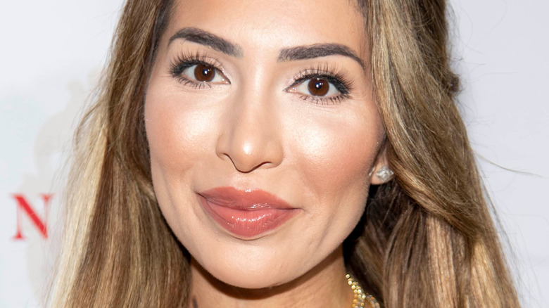 Farrah Abraham smiling with lips pressed together