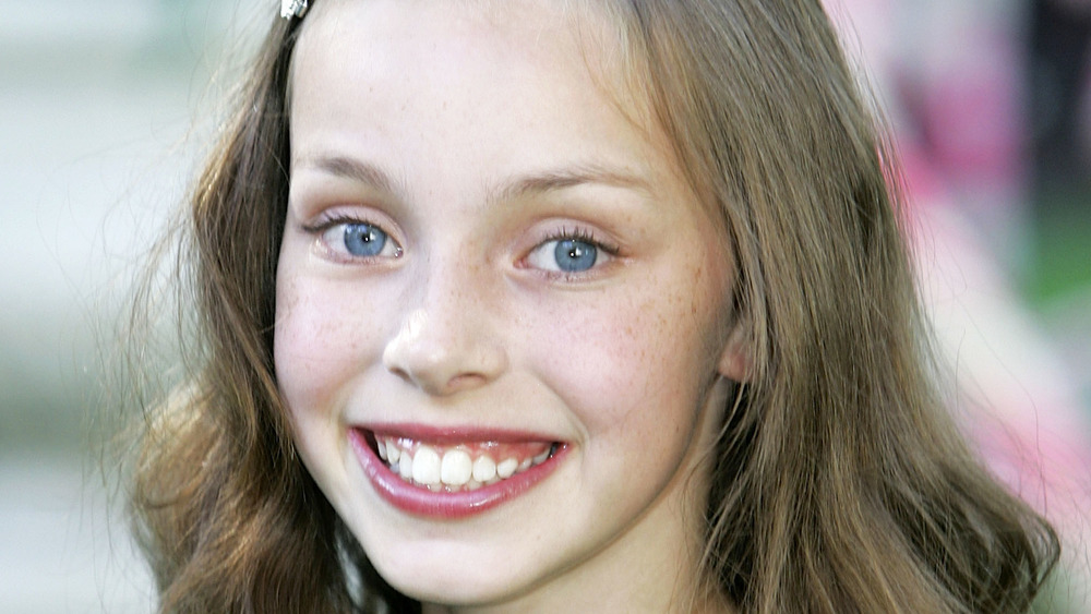 Julia Winter smiles at the U.K. premiere of "Charlie and the Chocolate Factory"