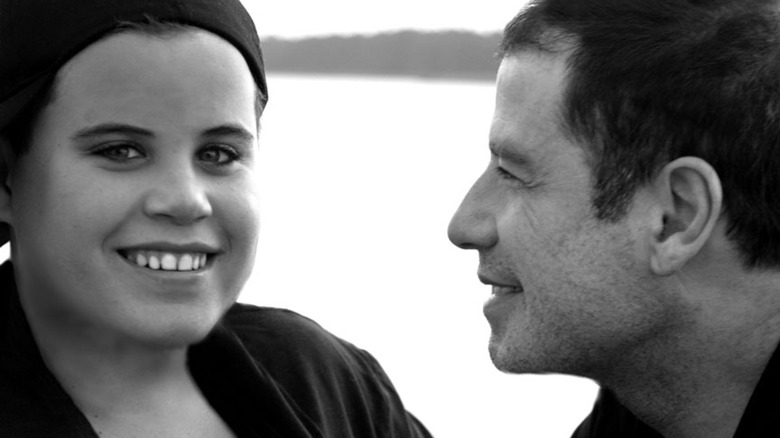 John Travolta smiling at son Jett Travolta