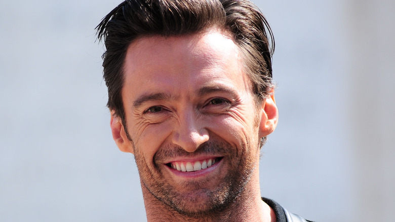 Hugh Jackman smiles at a photo call