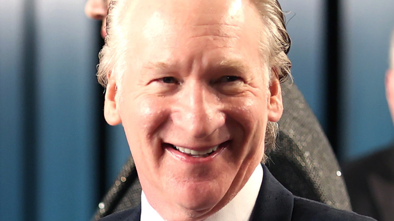 Bill Maher laughing at an Oscars party