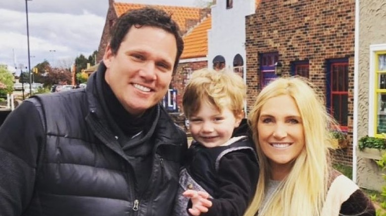 Bob Guiney and Jessica Canyon smiling with Grayson