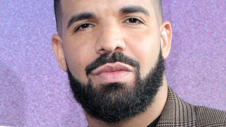 Drake wearing a suit jacket