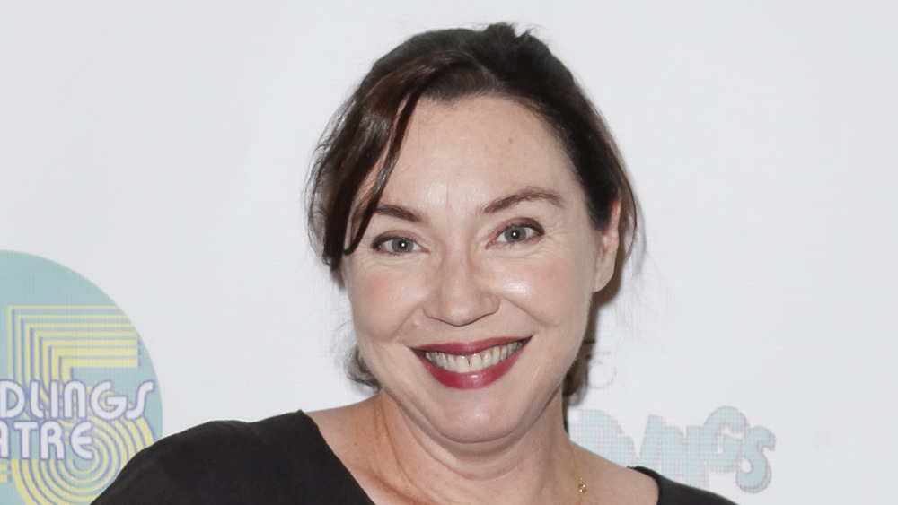 Stephanie Courtney wearing red lipstick