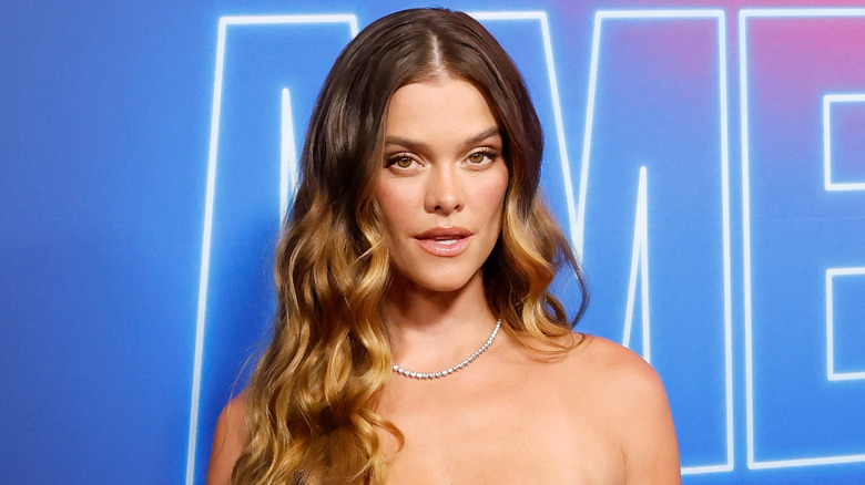 Nina Agdal posing at a premiere