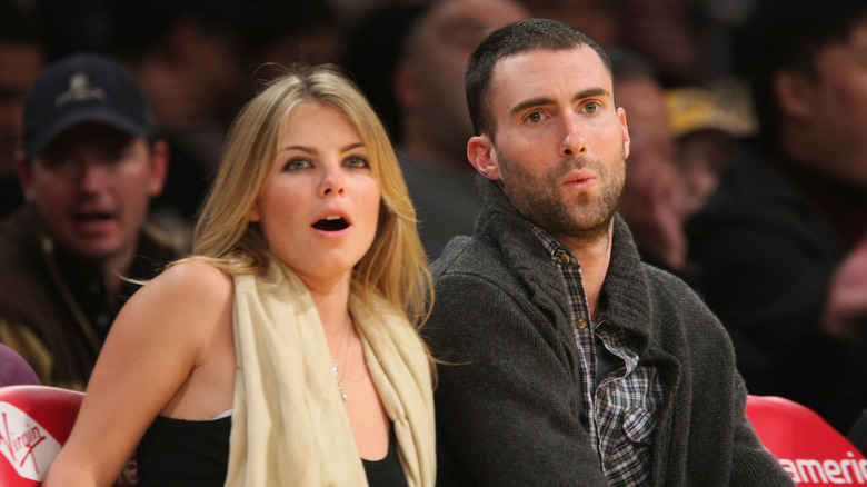 Adam Levine and Rebecca Ginos at a basketball game