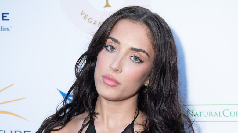 Sumner Stroh posing on a red carpet