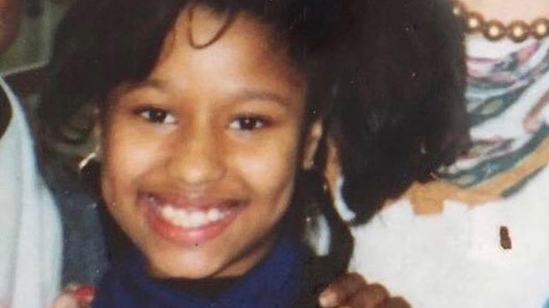 Young Nicki Minaj smiling.