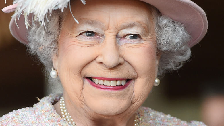 Queen Elizabeth smiles at an engagement